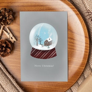 Cartolina "Snow Globe" / biglietto di auguri di Natale con illustrazione dipinta a mano