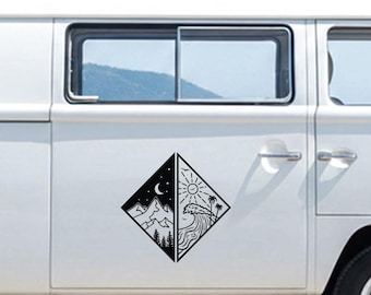 May include: Black and white diamond-shaped decal featuring a split design. One side depicts a mountain range under a starry night sky with a crescent moon. The other side shows a sun, waves, and palm trees, suggesting a beach scene.