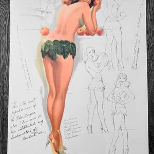 May include: Vintage 1958 calendar page featuring a pin-up illustration of a woman with apples, wearing a leaf-like garment. The calendar includes sketches and the text "Folies Bergere". The month of January is visible.