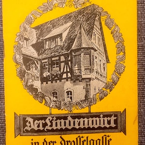 May include: A yellow postcard with a black and white illustration of a building with a sign that reads "Der Landenwirt in der Drosselgasse zu Rüdesheim".