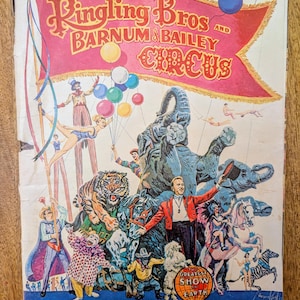 May include: Vintage Ringling Bros. and Barnum & Bailey Circus souvenir magazine cover. The cover features a colorful illustration of circus performers, animals, and the text "Greatest Show on Earth."
