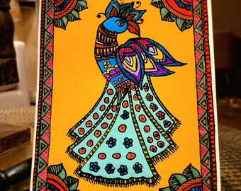 May include: A colorful painting of a peacock with a blue head and a teal tail with black and white polka dots. The peacock is surrounded by a yellow background and a colorful border.