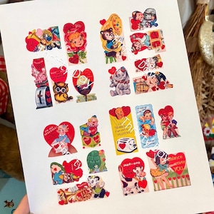 May include: A collection of vintage Valentine's Day cards on a white background. The cards feature various illustrations, including cherubs, animals, and hearts, in a vibrant color palette of red, yellow, and blue. Some cards have text.