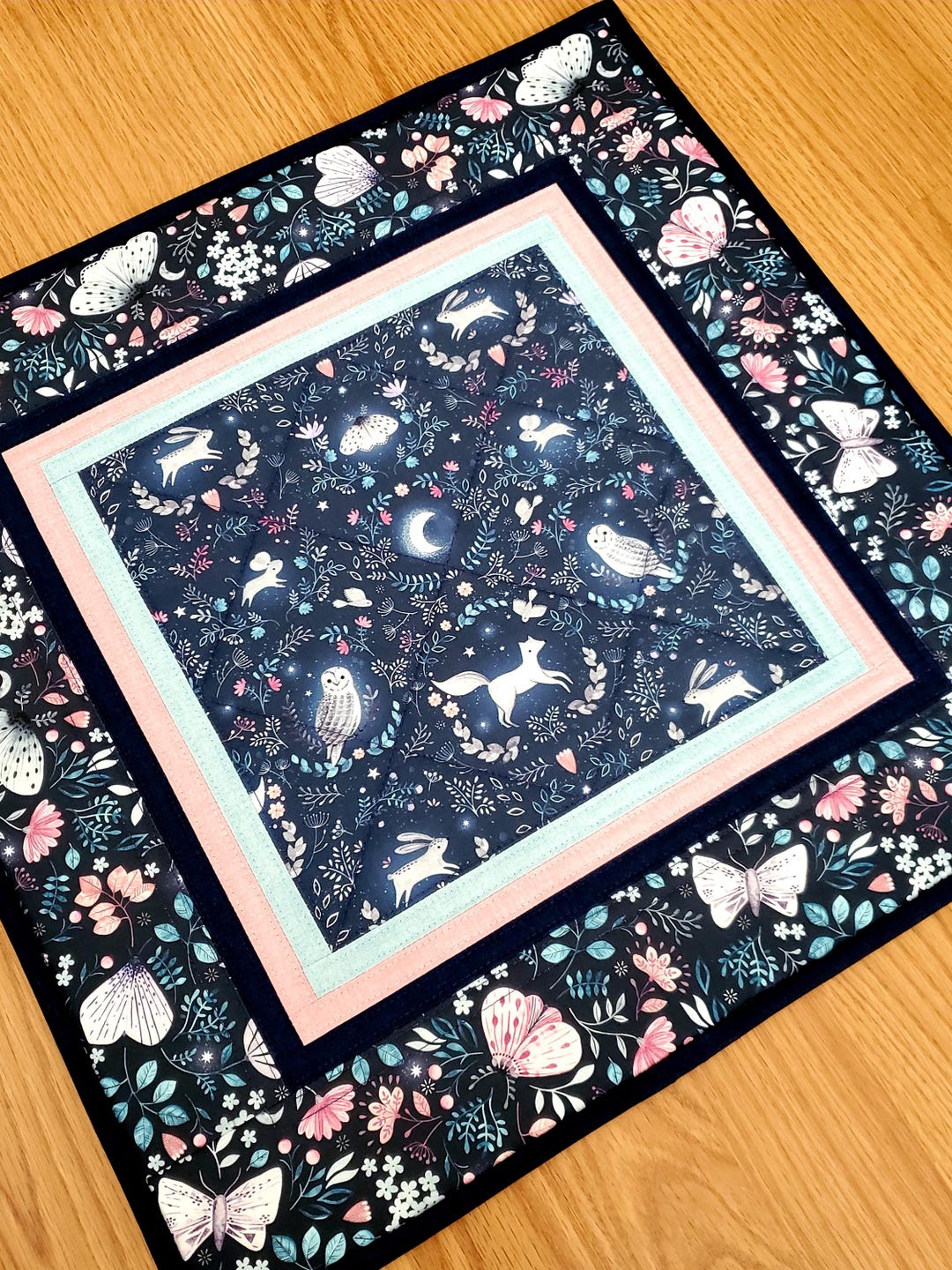 Magic Woods Quilted Table Topper NCU0DDK1114