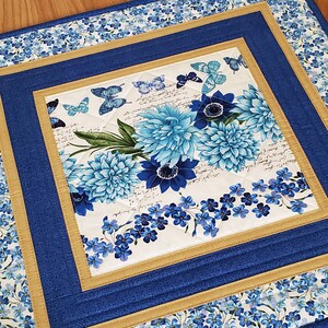 Golden Whispers Quilted Table Topper NCU0NTV099