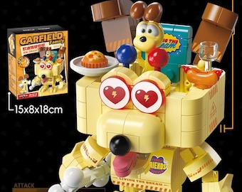 May include: A yellow Odie Vehicle toy made of building blocks, featuring a Garfield theme. The toy includes a box with the dimensions 15x8x18cm. The toy has a dog-like appearance with heart-shaped eyes and various accessories.