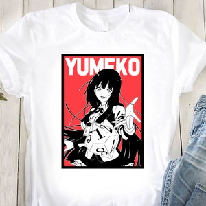 May include: A white t-shirt with a red and black graphic of an anime character with black hair and a red background. The text "YUMIKO" is printed in white on the graphic.