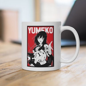 May include: White ceramic mug with a red and black illustration of a girl with long black hair holding a dice. The text "Yumeko" is printed in black on a red background.