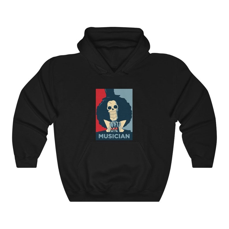 May include: Black hoodie with a graphic of a skeleton character with a top hat and the word "MUSICIAN" printed below. The graphic is in a red, white, and blue color scheme.