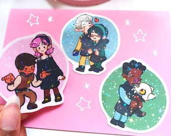 May include: Four holographic stickers featuring cartoon characters. The stickers are on a pink background with white stars. The characters are a couple holding hands, a couple kissing, a person holding a small animal, and a person holding a sword.
