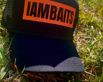 IAMBAITS: orange black trucker hat