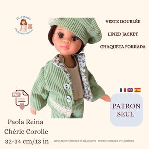 May include: A doll wearing a green corduroy jacket, beret, and pants. The jacket has white lace trim and white buttons. The doll is 13 inches tall. Text on the image includes "VESTE DOUBLÉE", "LINED JACKET", "CHAQUETA FORRADA", "PATRON SEUL", and "Paola Reina Chérie Corolle".