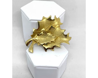 Gold tone three leaf brooch pin