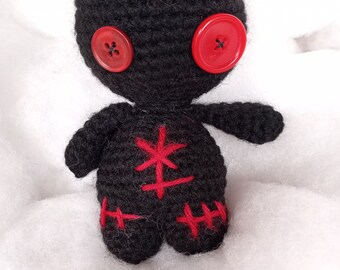 Black with red doll