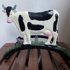 Vintage hose holder cow made of cast iron H.21 cm
