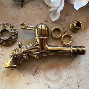 Brass faucet, dragon head motif, 1/2 inch