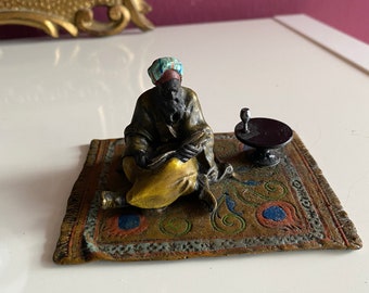 Vintage bronze figure Viennese style reading Arab on carpet