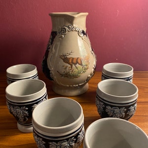 Vintage wine jug with 6 cups of porcelain handmade from Portugal