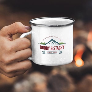 May include: White enamel camping mug with a black rim and a logo that says "Adventuring Together Bobby & Stacey Since 1998".