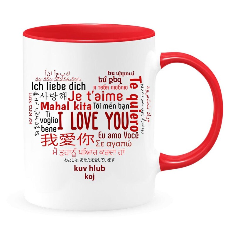 May include: White ceramic mug with a red rim and handle. The mug features a red word cloud with the phrase "I Love You" in English, along with the translation of "I Love You" in multiple languages.