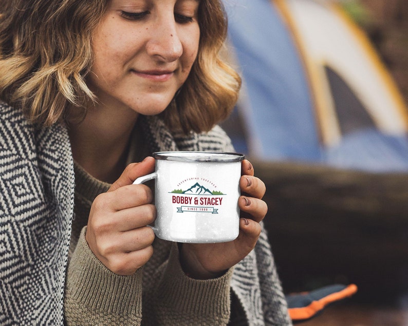 May include: White enamel camping mug with a black and red logo that says "Bobby & Stacey" with a mountain range graphic and the text "Since 1988".