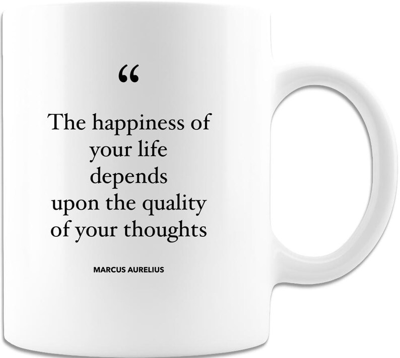 May include: White ceramic mug with a curved handle. The mug features the quote, "The happiness of your life depends upon the quality of your thoughts" attributed to Marcus Aurelius, printed in black text.