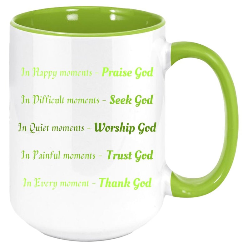 May include: White ceramic mug with a green interior and handle. The mug features the text "In Happy moments - Praise God, In Difficult moments - Seek God, In Quiet moments - Worship God, In Painful moments - Trust God, In Every moment - Thank God."