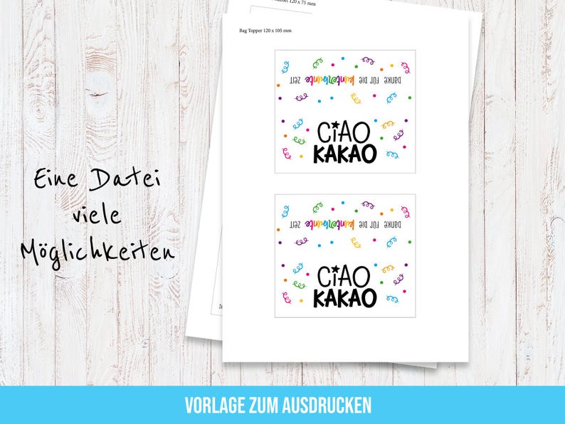 May include: Two white printed sheets with the text "CIAO KAKAO" in black, green, and yellow, surrounded by colorful confetti. The text "Danke f&uuml;r die kunterbunte Zeit" is also present. The sheets are on a wooden surface.