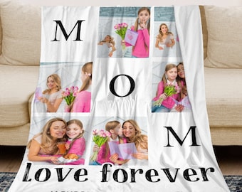 May include: White fleece blanket with a collage of photos of a mother and her children. The blanket has the word "MOM" in large black letters and the words "love forever" in smaller black letters. The names "JACKSON | KELLY | MICHAEL" are printed below the text.