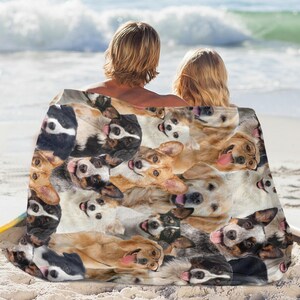 May include: A beach towel with a colorful pattern of various dog breeds. The towel features a variety of dog breeds, including Australian Shepherds, Golden Retrievers, and Border Collies. The towel is perfect for use at the beach or pool.
