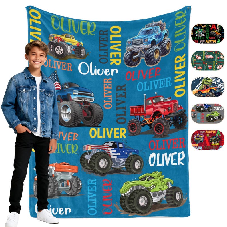 May include: A blue monster truck blanket featuring various monster truck designs in yellow, blue, red, and green. The name "Oliver" is printed throughout the design. Additional small designs are shown on the right side of the blanket.