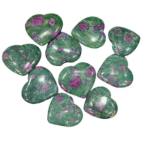 May include: Ten green and pink heart-shaped stones with a speckled pattern.