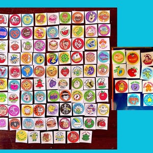 May include: A collection of vintage stickers with various cartoon characters and phrases. The stickers are square or circular, featuring bright colors and playful designs. Some stickers have text like "Cool" and "Super Star".