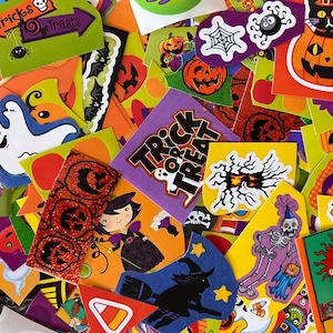 May include: A collection of colorful Halloween stickers featuring various spooky and fun designs, including ghosts, pumpkins, bats, witches, and skeletons. The stickers have phrases like "Trick or Treat" and "Happy Halloween".