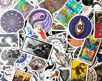 May include: A collection of colorful stickers featuring tarot card imagery, celestial symbols, and astrological signs. The stickers are printed on white paper and have a glossy finish.