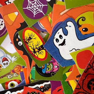 May include: A collection of colorful Halloween stickers featuring ghosts, bats, spiders, and other spooky designs. The stickers are perfect for decorating notebooks, laptops, water bottles, and other surfaces.