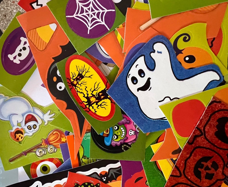 May include: A collection of colorful Halloween stickers featuring ghosts, bats, spiders, and other spooky designs. The stickers are perfect for decorating notebooks, laptops, water bottles, and other surfaces.