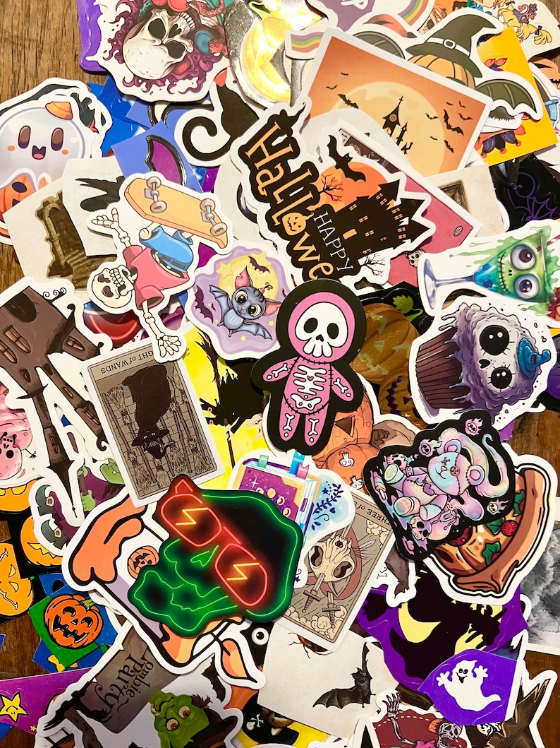 May include: A collection of Halloween themed stickers featuring various spooky characters, including ghosts, skeletons, bats, and pumpkins. The stickers are colorful and feature a variety of designs, including cartoon characters, illustrations, and text. The stickers are perfect for decorating notebooks, laptops, water bottles, and other items.