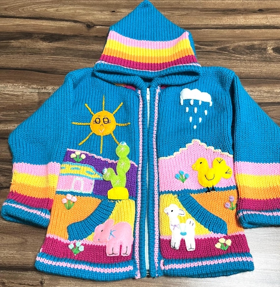 ペルーの職人によるペルー刺繍のハンドメイドの子供用セーター