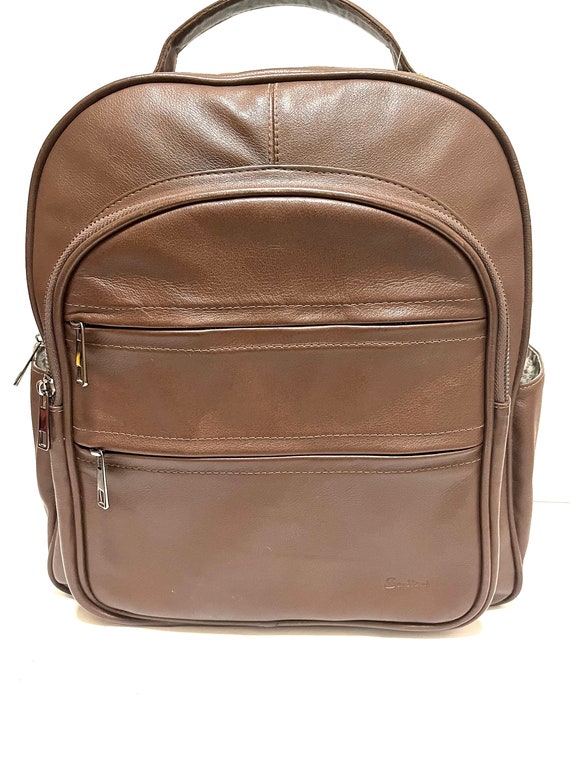 brown leather backpack with side zippers Brown Leather Backpack Handmade From Peru