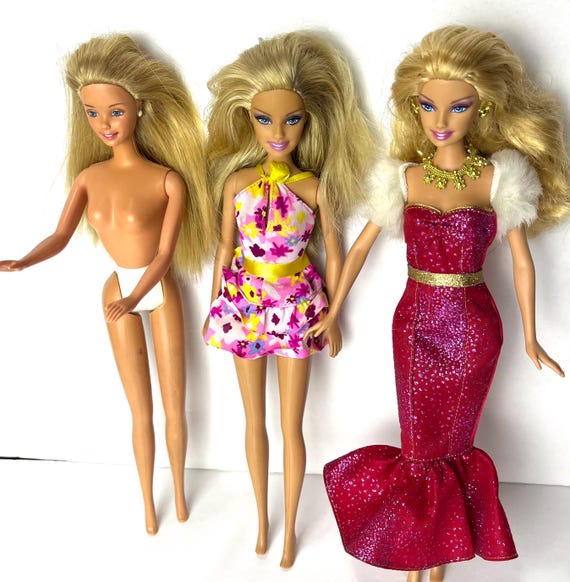 Three barbies sale