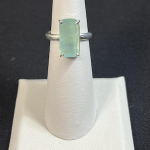 May include: A rustic wooden sign with the text "Welcome to our porch" in white lettering. The sign features a distressed finish and a simple, inviting design, perfect for outdoor decor.