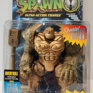 以下が含まれることがあります： Spawn Ultra-Action Figuresシリーズの、金色のOvertkillアクションフィギュア。フィギュアは、「Special Edition」と「Comic Book」の文字が入った透明なプラスチックパッケージに入っています。フィギュアは取り外し可能な頭部を持っています。