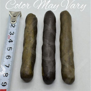 May include: Three brown and black twisted sticks, each about 4 inches long, are lined up next to a measuring tape. The text "Color May Vary" is visible at the top of the image.