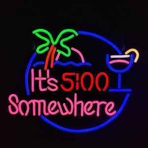 May include: Neon sign with a blue circle, a green palm tree, a red "It's 5:00" and pink "Somewhere" text, and a blue cocktail glass with a pink drink and a yellow straw.