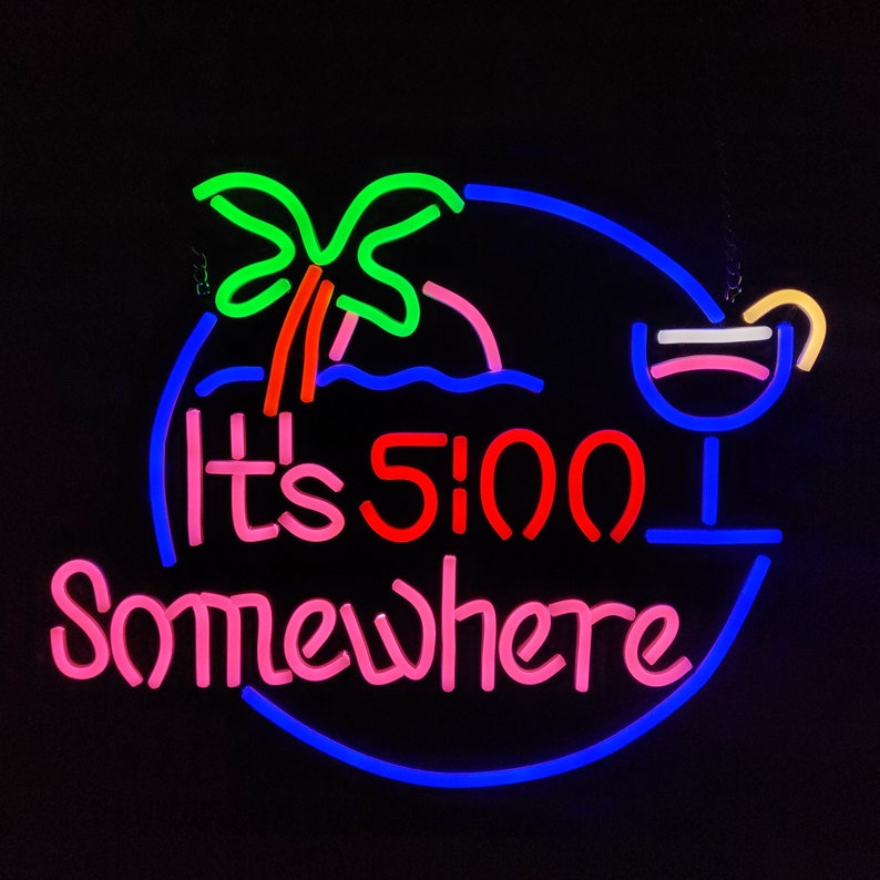 May include: Neon sign with a blue circle, a green palm tree, a red "It's 5:00" and pink "Somewhere" text, and a blue cocktail glass with a pink drink and a yellow straw.