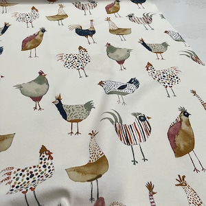 May include: White fabric with a repeating pattern of colorful chickens. The chickens are illustrated in a whimsical style with various colors and patterns.