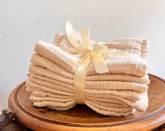 A set of 6 muslin hand towels. The color is cream. Organic cotton, muslin. The fabric is hypoallergenic.