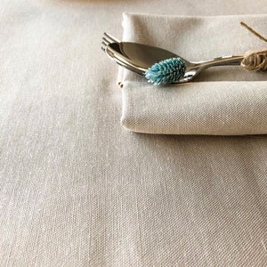 Water-repellent tablecloth beige color. Cottagecore decor. Table setting.This effect retains spilled liquids on the surface.