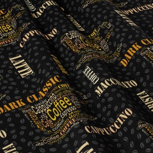 May include: Black fabric with a repeating pattern of coffee beans and words related to coffee, including "Cappuccino", "Dark Classic", "Coffee", "Espresso", "Macchiato", and "Latte".